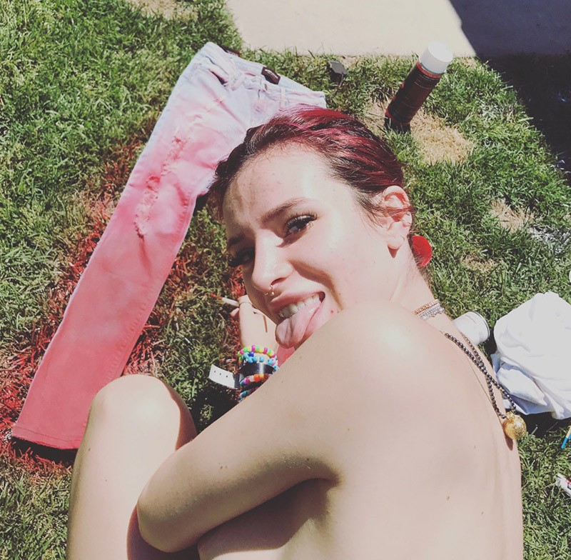 Bella Thorne Goes Topless & Flashes Nipple While Painting Outside — Pics